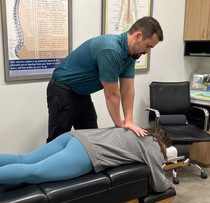 patient being treated for back pain waukee at Core Chiropractic in Waukee, IA 