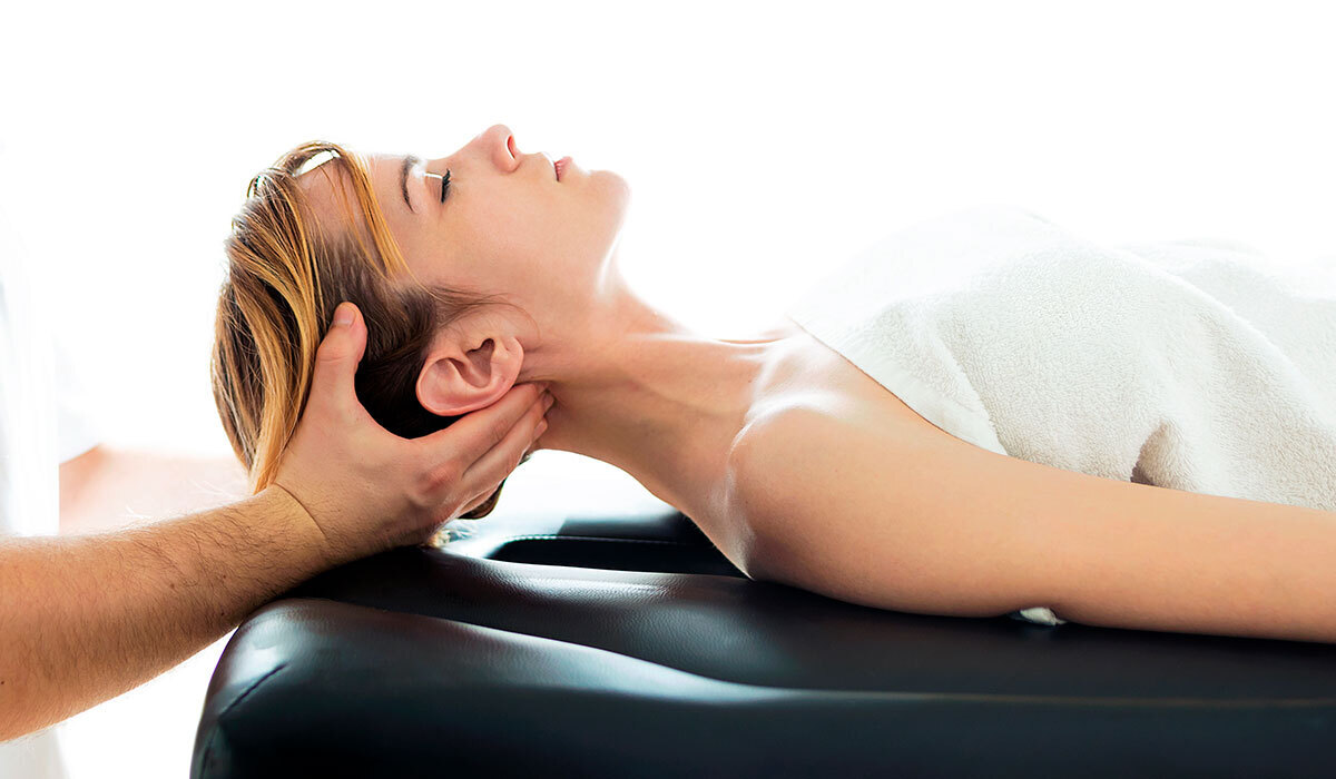 Neck pain chiropractor Waukee performing natural adjustment at Core Chiropractic.