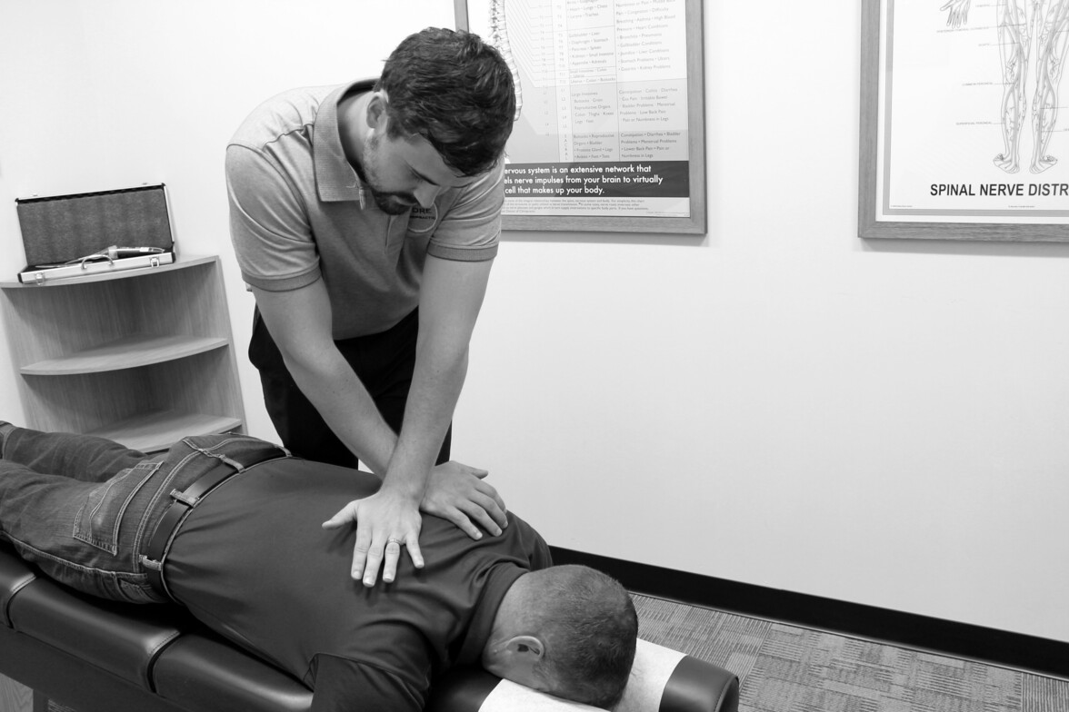Core Chiropractic Waukee chiropractor performing personalized adjustment for superior spinal care
